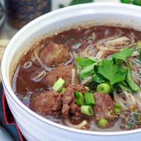 Thai Boat Noodle Soup · Thai style noodle soup in a stewed broth. Your choice of either beef or pork