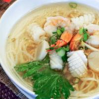 Seafood Noodle Soup · Wide rice noodle, shrimp, scallops, calamari, bean sprouts, green onion and cilantro in clea...