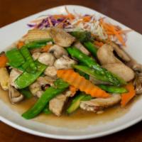 Grilled Chicken Delight · Grilled chicken breast stir-fried with asparagus, carrots, snow peas and mushrooms with brow...
