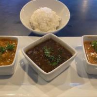 Triple Power Sampler · Red beans, shrimp Creole and crawfish etouffee with white rice.