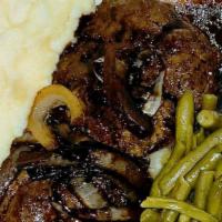 Ju Ju Chop Beef Steak With Onions & Gravy · 10 oz chop steak patty covered with onions and brown gravy lagniappe and green beans.