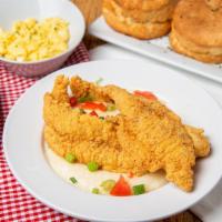 Fried Catfish & Stone Grits · Crispy fried fish served with classic buttery grits and toast.