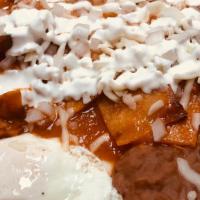 Chilaquiles · Corn tortilla pieces lightly fried topped with salsa, cheese, onions, and sour cream. Served...