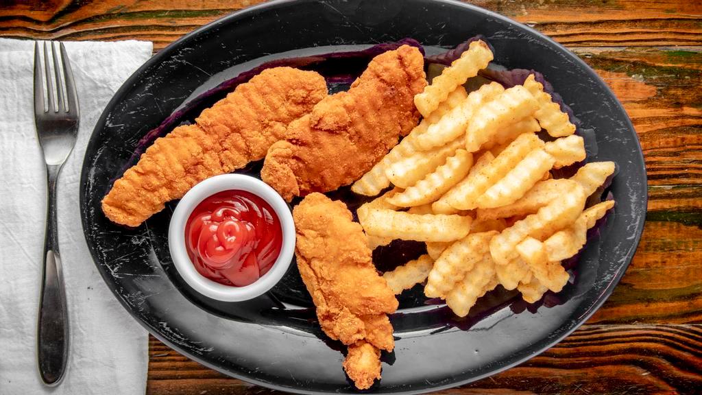 Chicken Tender Basket · Three chicken tenders fried golden served with a basket of fries and ketchup.