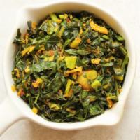 Collard Greens · Fresh leafy greens served with a house mix of veggies.