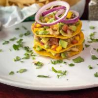 Ceviche Tostadas · Shrimp, fish, mango, pico and avocado