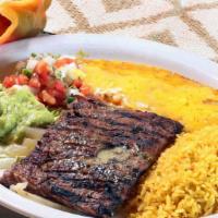 El Tampiqueno Platter · 6 ounce grilled fajita steak served over grilled onions and one cheese enchilada, served wit...