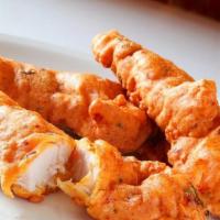 Chicken Pakora · Boneless chicken pieces dipped in a batter of spiced garbanzo bean flour and fried.