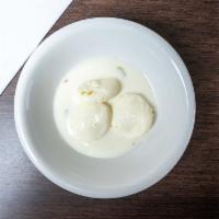 Rasmalai · Creamed cheese patties in sweet thickened milk sauce.
