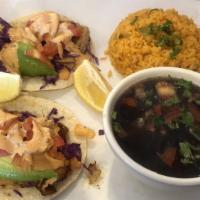 Pescado Taco Plate(2)  · Two fish tacos served with rice and beans.