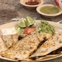 Quesadilla Chica · Small Quesadilla with your choice of protein.