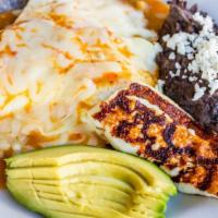 Huevos Rancheros · Over easy eggs served on top of corn tortillas, refried beans, house-made ranchero salsa, an...