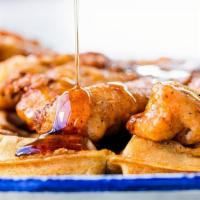 Chicken And Waffles · Our crispy homemade waffle topped with a fried chicken breast.