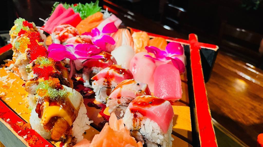 Omakase Deluxe · Salad, chef's choice of 7 pieces sushi, 7 pieces sashimi & 2 choice of any chef's special roll.