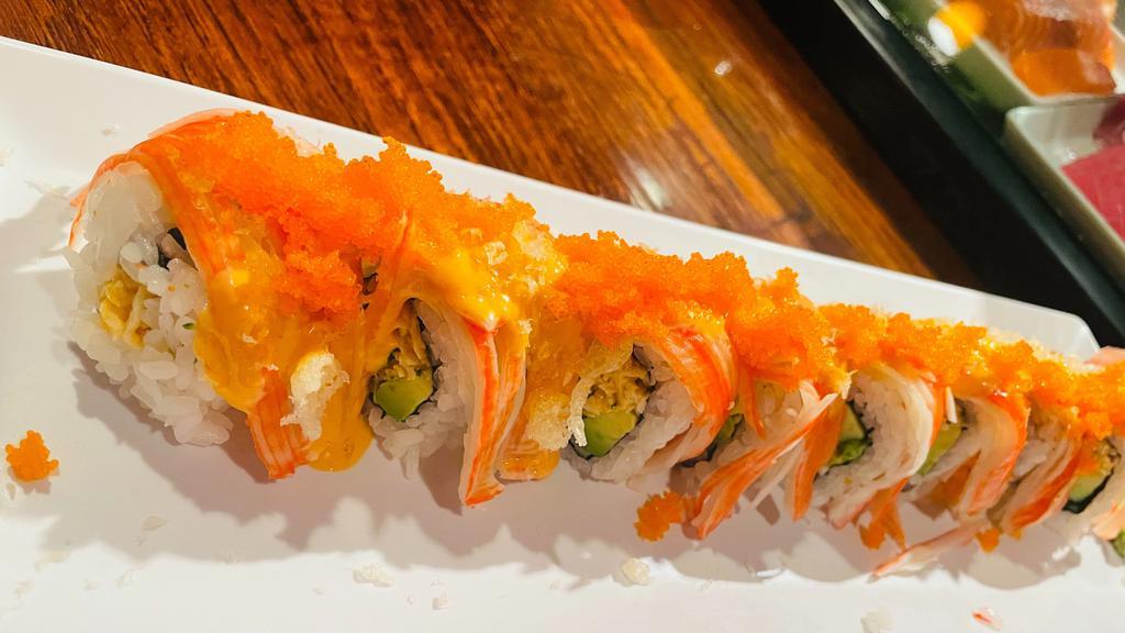 Texan Roll · Spicy. Spicy crab meat avocado inside, topped with crab stick, tempura crumbles, spicy mayo, masago.