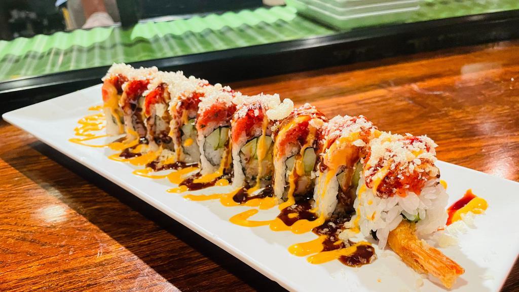 Hot Night Roll · Shrimp tempura, avocado, cucumber, and crab stick inside, topped with spicy tuna, tempura, crumbles, eel sauce, spicy mayo.