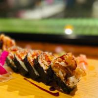 Rock N' Roll · Shrimp tempura, avocado, cucumber, crab stick, cream cheese, masago inside, topped with eel ...