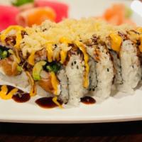 Crazy Salmon Roll · Spicy. Salmon, cream cheese, avocado, jalapeno, masago, crab stick inside, topped with tempu...