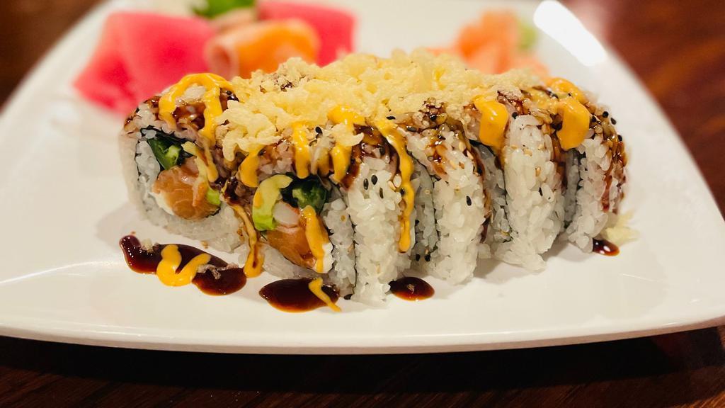 Crazy Salmon Roll · Spicy. Salmon, cream cheese, avocado, jalapeno, masago, crab stick inside, topped with tempura crumbles, eel sauce, spicy mayo.