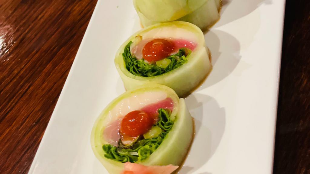 Iron Chef Roll (No Rice) · Spicy. Tuna, salmon, white fish, avocado, crab stick, asparagus inside, wrapped in peeled cucumber, topped with ponzu sauce, sriracha.