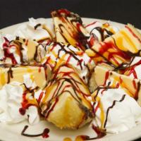 Banana Tempura Ice Cream · Fresh banana coated in batter and fried. Served with a scoop of ice cream.
