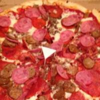 Meat Lover · Pepperoni, ground beef, Canadian bacon, bacon, sausage.
