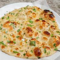 Garlic Naan · Naan with touch of garlic with butter.