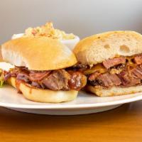 Bbq Club · Smoked brisket, cheddar cheese, BBQ sauce and choice of smoked or jalapeno cheddar sausage w...