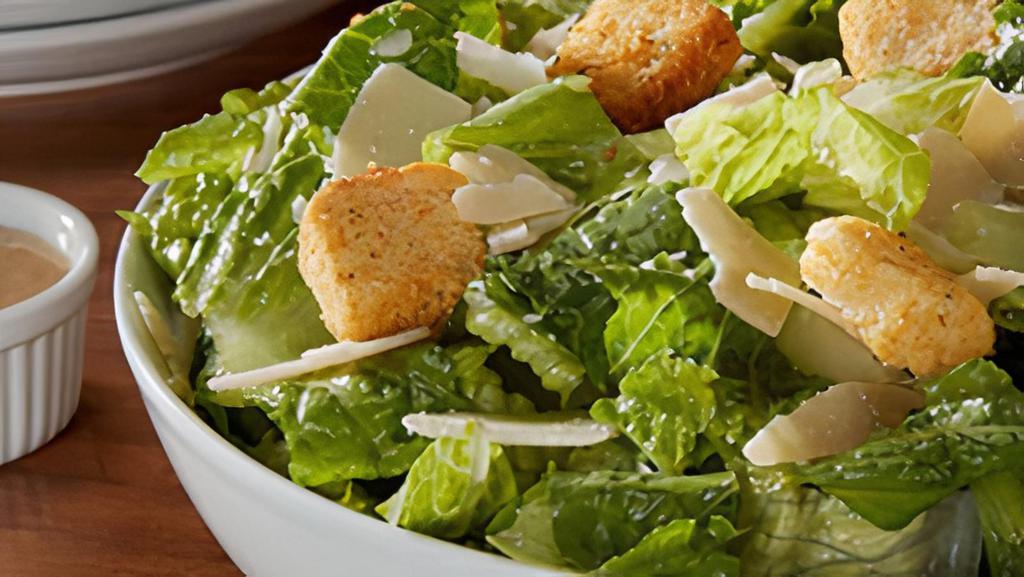 Caesar Salad · Caesar salad is served with croutons and shaved Parmesan cheese. Add grilled chicken for an additional charge.