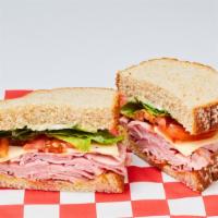 Ham & Swiss Cheese Sandwich · Boar's Head Ham and Swiss Cheese, Lettuce, Tomato, Mayo and Mustard on Wheat Bread