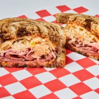 Reuben · Pastrami, Melted Swiss Cheese, Sauerkraut, Homemade Thousand Island on Rye or Marble Bread