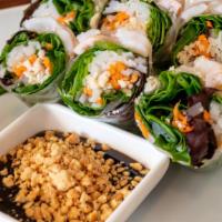 Fresh Spring Roll · Green salad, chicken, shrimp, noodles, and carrots rolled with clear rice paper.