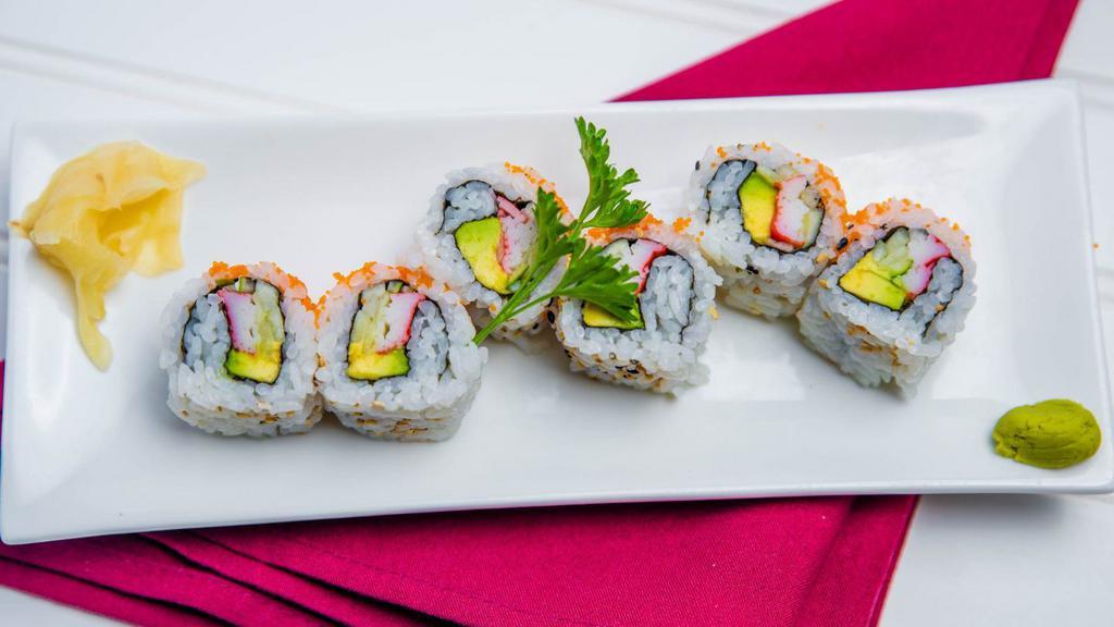 California Roll · Inside; crab stick, avocado, and cucumber outside; rice, sesame seeds, and tobiko.