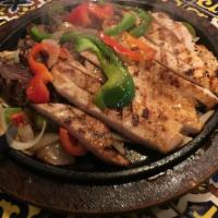 Fajita Salad · Grilled chicken or beef over a bed of romaine and iceberg lettuce red cabbage, carrots, toma...
