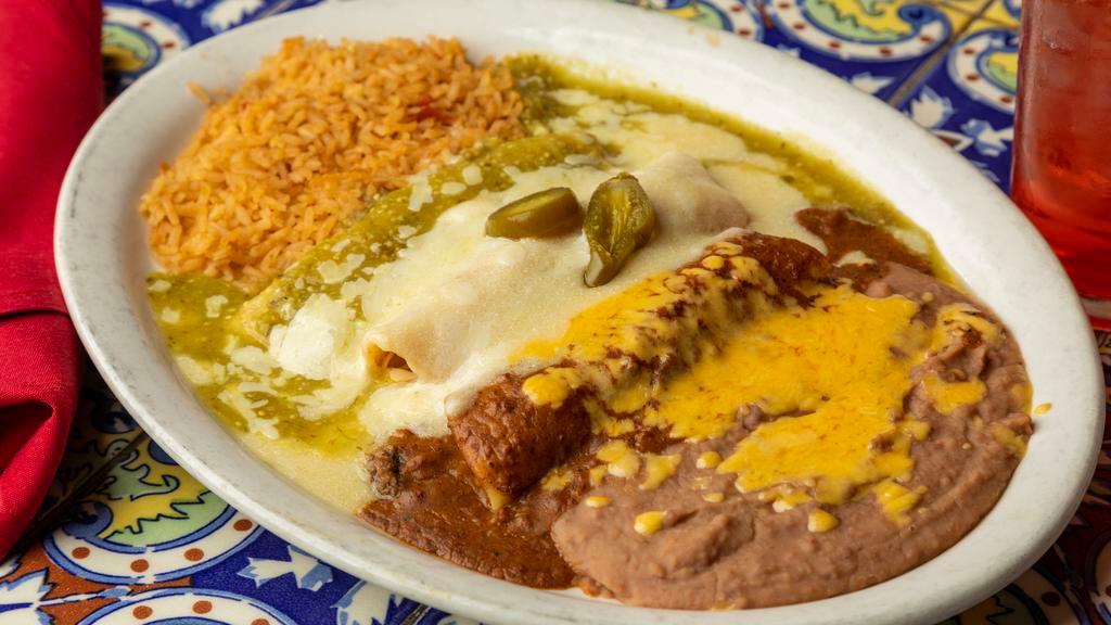 Mexican Flag · One Monterrey jack cheese enchilada with salsa Verde, one chicken enchilada with sour cream sauce and one beef enchilada with chili con carne, served with rice and beans.