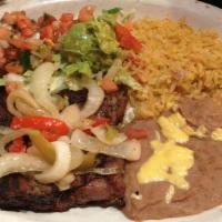 Carne Asada · A marinated beef skirt steak, grilled and specially seasoned served with charro bean soup ri...