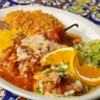 Fajita Chile Relleno · A battered poblano pepper stuffed with ground beef. Shredded chicken or cheese topped with o...