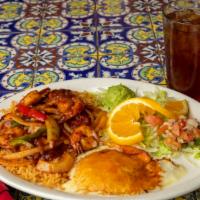 Shrimp Sadie · Shrimp sautéed in chile ancho sauce with bell peppers and onions served with rice, beans, gu...