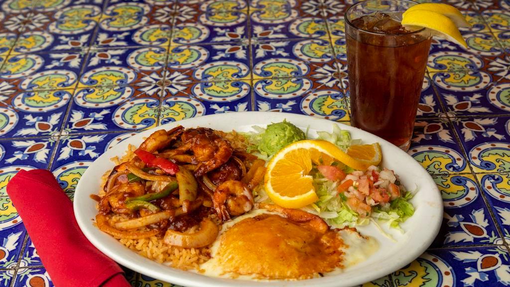 Shrimp Sadie · Shrimp sautéed in chile ancho sauce with bell peppers and onions served with rice, beans, guacamole, pico de gallo and grilled linares.