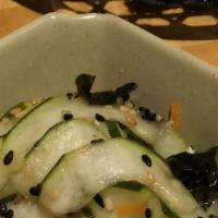 Cucumber Salad · Marinated fresh sliced cucumber with shredded carrots and sesame seeds.