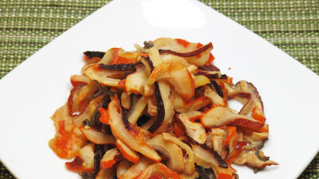 Squid Salad · Tender squid sliced and marinated with an assortment of vegetables.