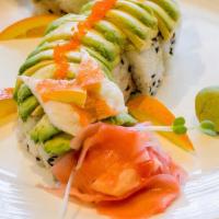 Dragon Roll · Yellow tail roll, scallion with avocado outside, shrimp as garnish.