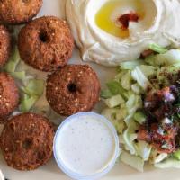 Falafel Platter · 5 pieces of falafel topped with tahini sauce and served with salad and pita bread.