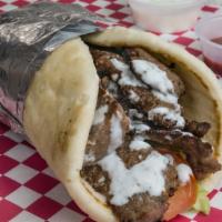 Gyro Wrap · Halal Beef Gyro wrap, comes with lettuce, tomatoes, onions, and our special delicious white ...
