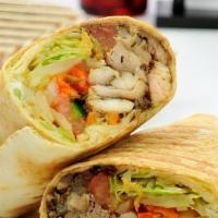 Chicken Shawarma Wrap · Halal Chicken shawarma wrap. comes with pickles, and our special delicious garlic sauce!