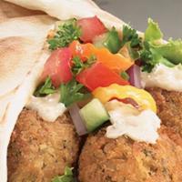 Falafel Pocket Sandwich · Veggie falafel wrap, comes with lettuce, tomatoes, onions, and our special delicious white s...