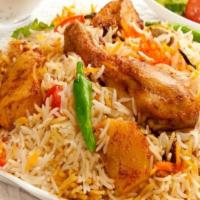 Vijayawada Chicken Dum Biryani · Spiced chicken Biryani topped with a personal serving of  'spicy-crispy' boneless chicken ga...