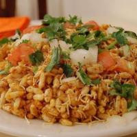 Bhel Puri · A mix of puffed rice, sev, potato, tomato, onion and sweet spicy chutney with spicy house sa...