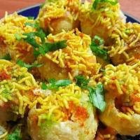 Sev Puri · Paapdi, sev, potatoes,lentils, onion and curd served with spicy house sauce. VEGAN OPTION - ...