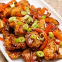 Chili Chicken · Marinated Chili chicken cooked on slow flame. Sautéed with peppers and onion.